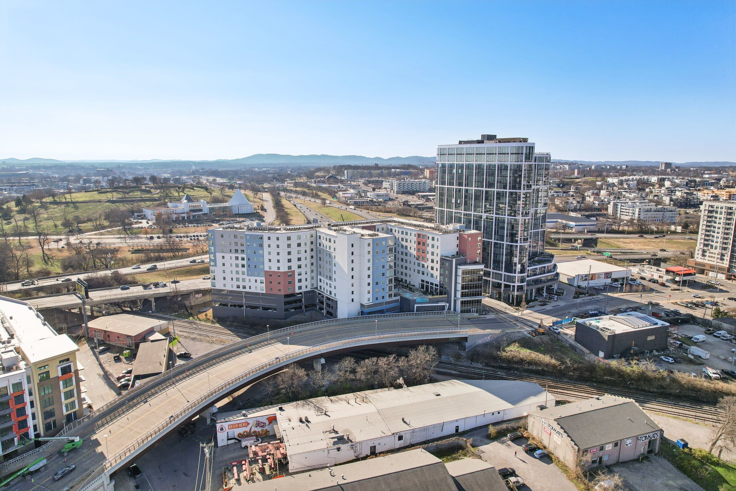 Aerial view of Haven at The Gulch with the downtown Nashville skyline behind it